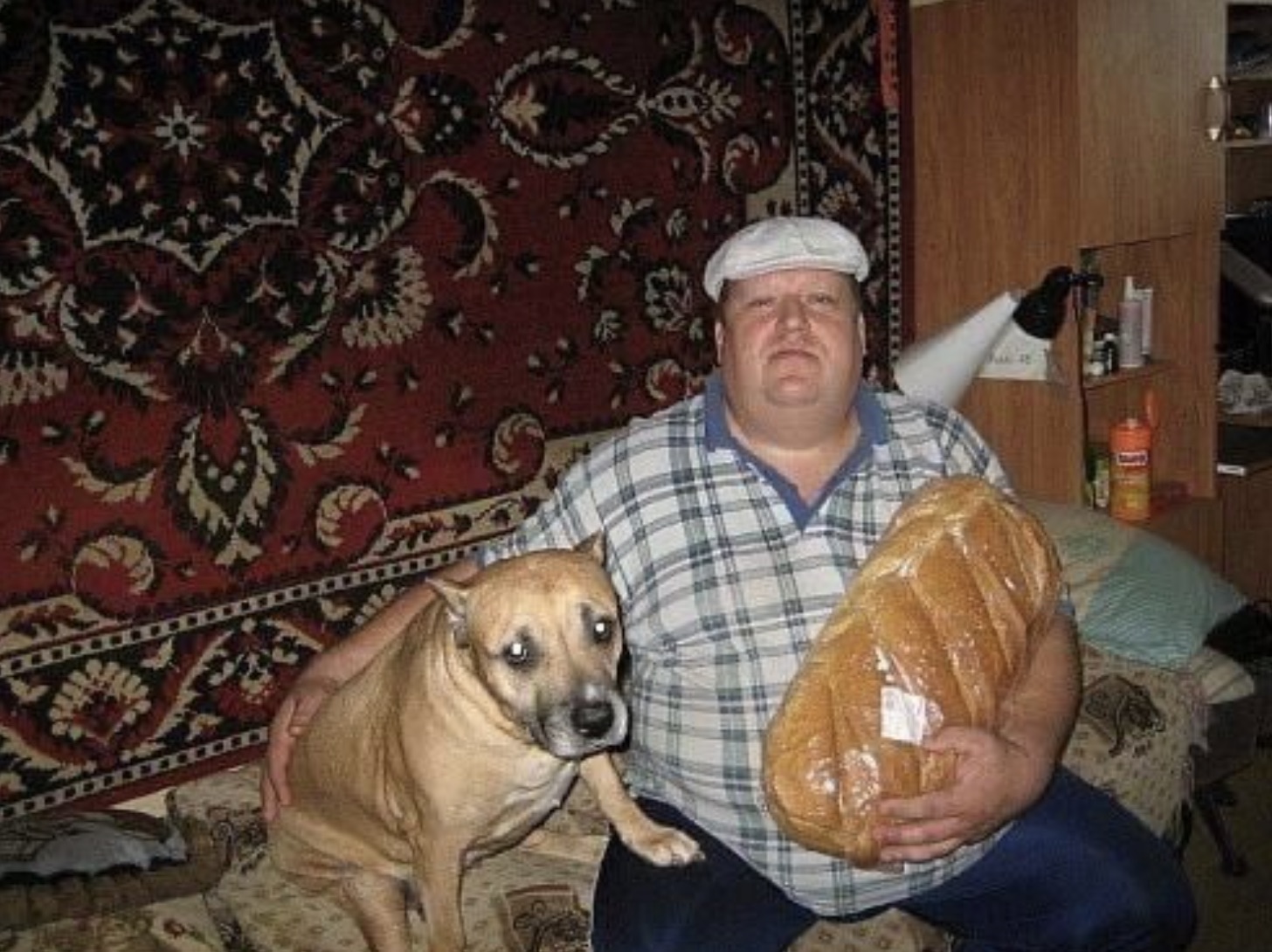 man with bread and dog